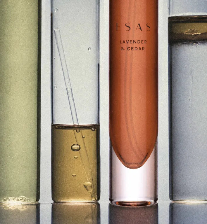 Four ESAS fragrance samples lined up in glass tubes