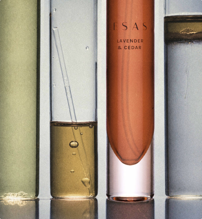 Four ESAS fragrance samples lined up in glass tubes