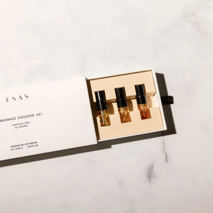 The ESAS fragrance discovery set open on a marble surface