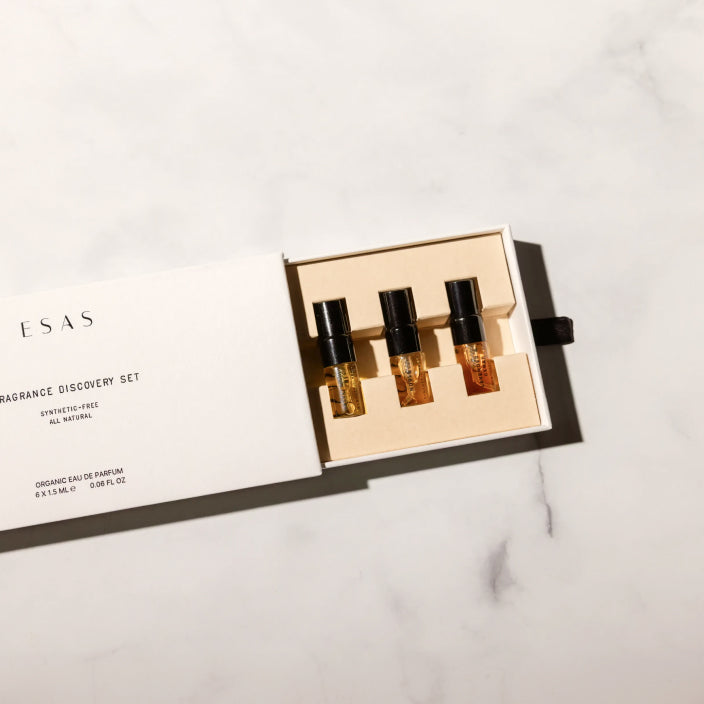 The ESAS fragrance discovery set open on a marble surface